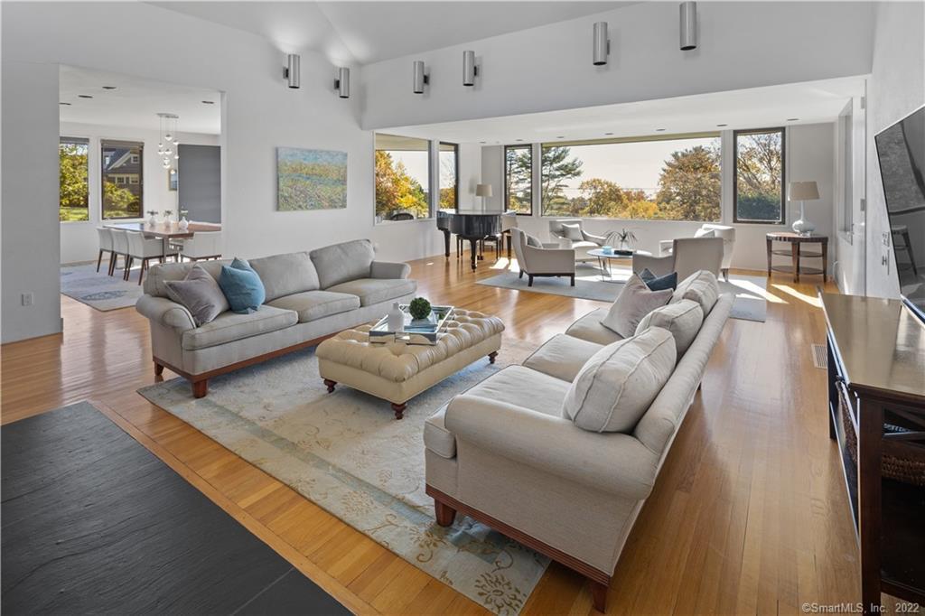 5 Longview Road Westport, CT 06880 - Photo 11 of 36 a living room with furniture wooden floor and a large window