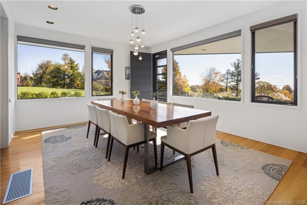 5 Longview Road Westport, CT 06880 - Photo 13 of 36 a dining room with furniture a large window and a rug