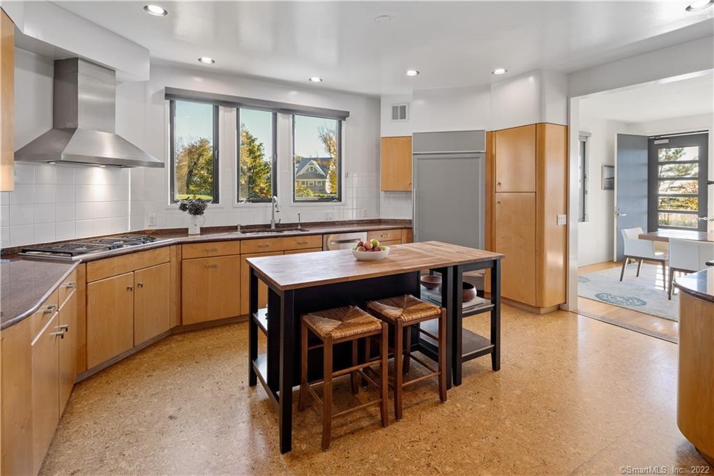 5 Longview Road Westport, CT 06880 - Photo 14 of 36 a kitchen with a table chairs sink and refrigerator