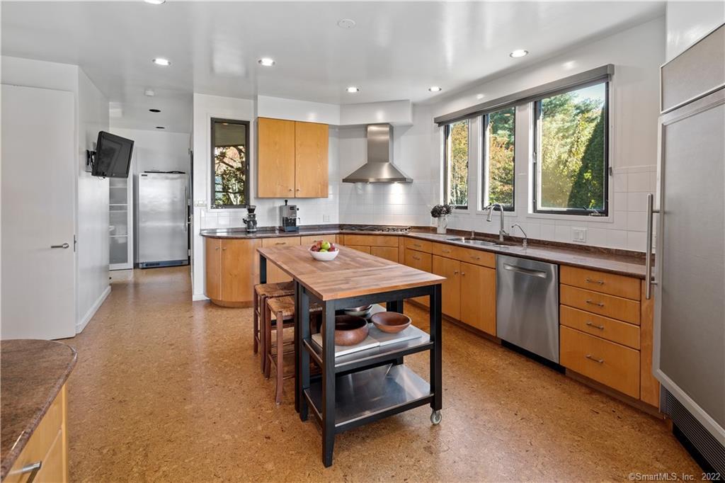 5 Longview Road Westport, CT 06880 - Photo 15 of 36 a kitchen with stainless steel appliances granite countertop a sink a stove and a refrigerator