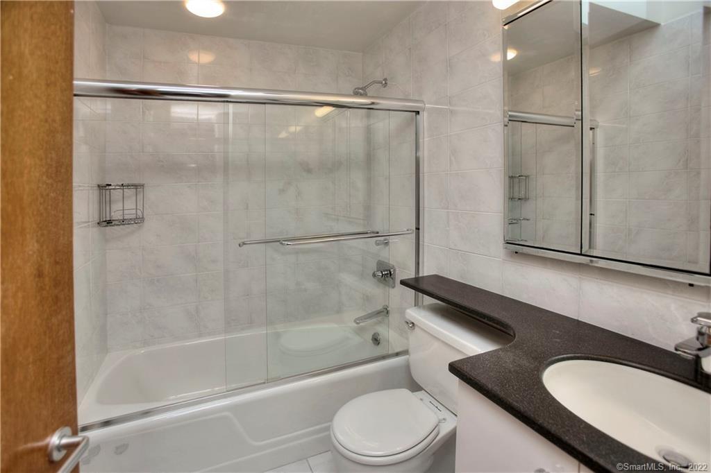 5 Longview Road Westport, CT 06880 - Photo 29 of 36 a bathroom with a granite countertop bathtub shower sink vanity and toilet