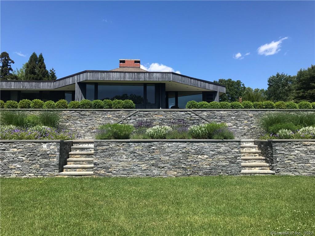 5 Longview Road Westport, CT 06880 - Photo 5 of 36 a front view of a house with a yard