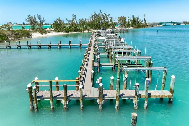a view of a lake with a table and chairs