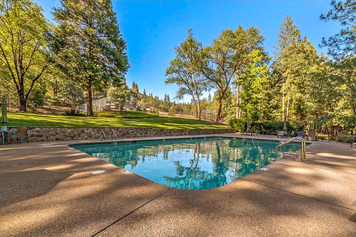 5015 Shooting Star Road Pollock Pines, CA 95726 - Photo 39 of 44 a view of a swimming pool with a patio