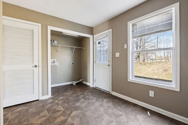a view of an empty room with a window