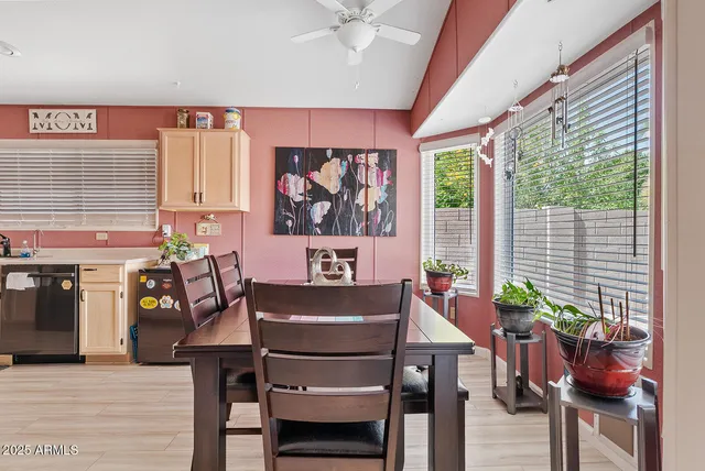 a view of a dining room with furniture window and outside view