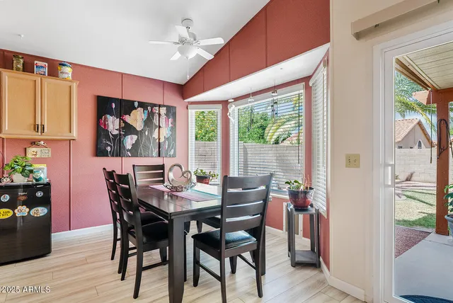 a view of a dining room with furniture window and outside view