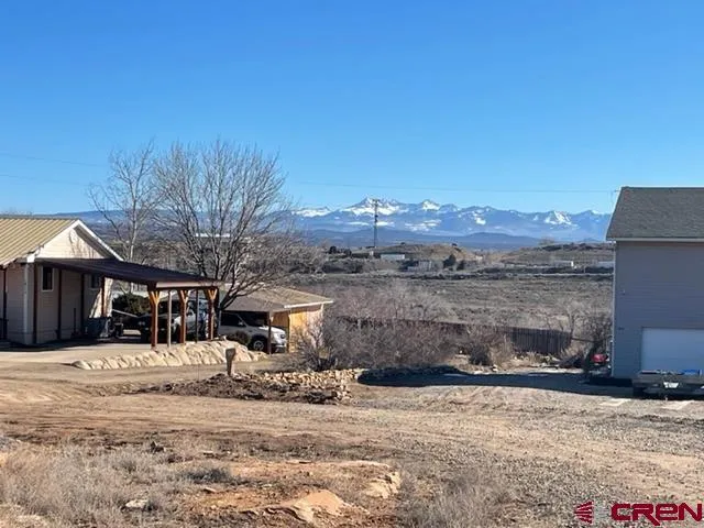 a view of a town with large trees
