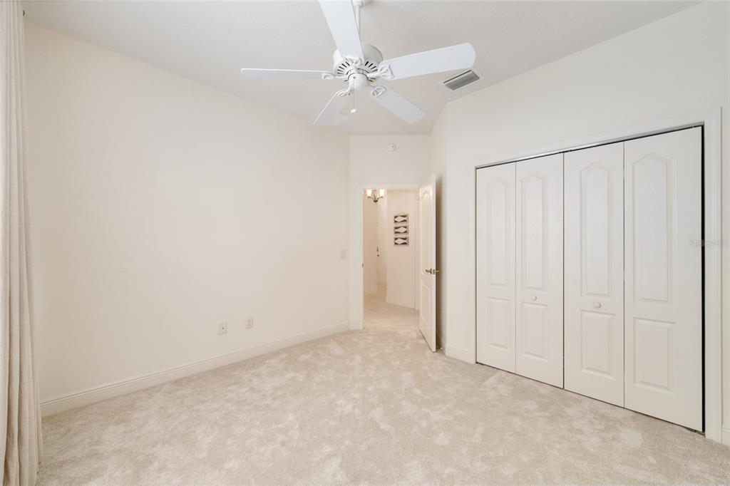 879 Chapman Loop The Villages, FL 32162 - Photo 27 of 34 an empty room with fan