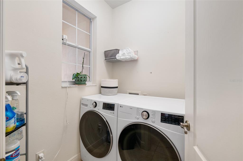 879 Chapman Loop The Villages, FL 32162 - Photo 28 of 34 a view of livingroom with washer and dryer