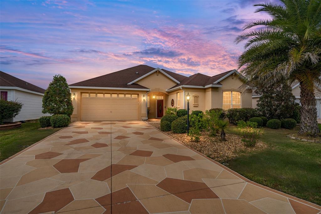 879 Chapman Loop The Villages, FL 32162 - Photo 3 of 34 a front view of a house with garden