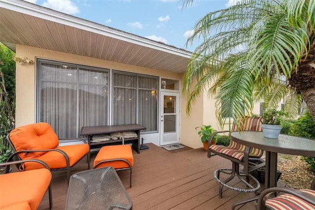 a backyard of a house with seating space