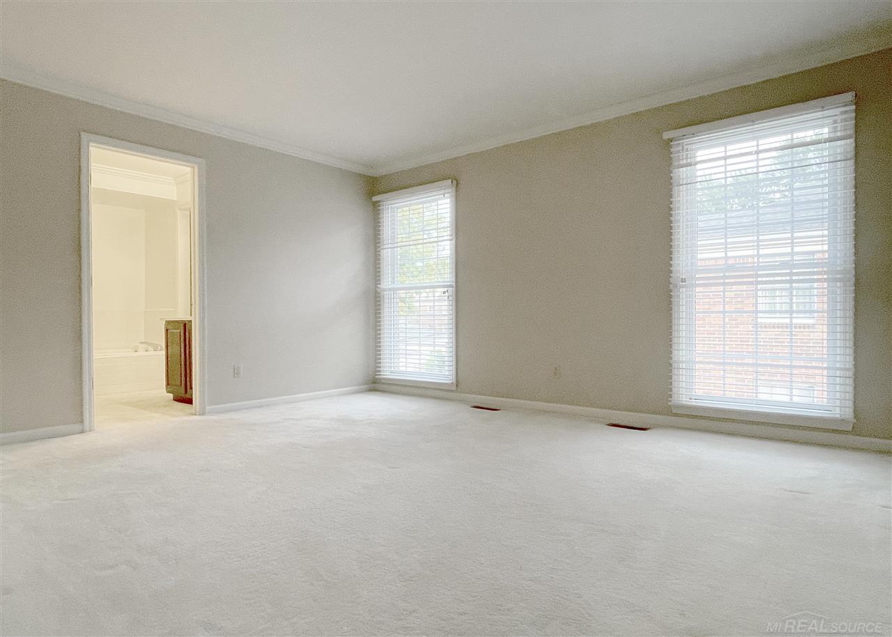 744 Trombley Road Grosse Pointe, MI 48230 - Photo 12 of 32 Master Suite with large private bathroom with sequestered commode and walk-in closet.