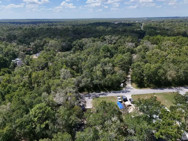 an aerial view of residential house with outdoor space