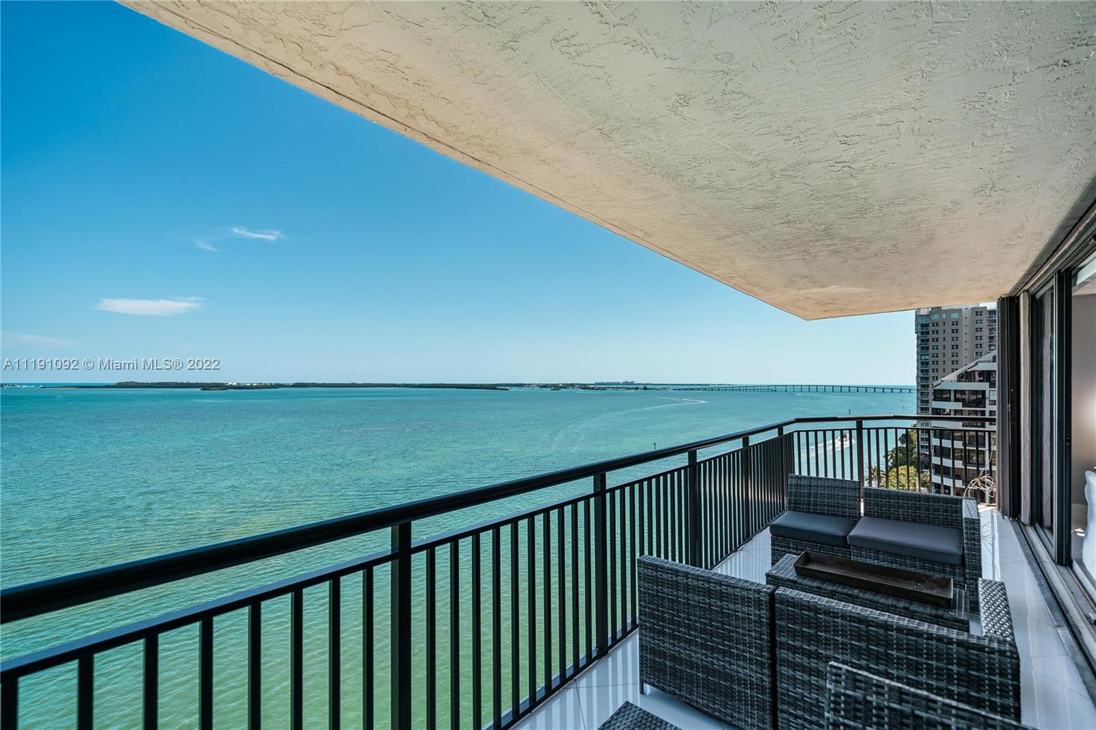 540 Brickell Key Drive, Unit 1427 Miami, FL 33131 - Photo 13 of 16 a balcony with view of an ocean