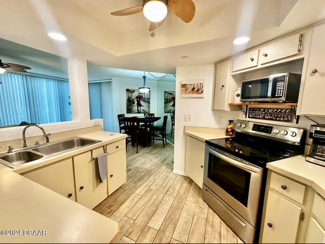 a kitchen with a stove and a sink
