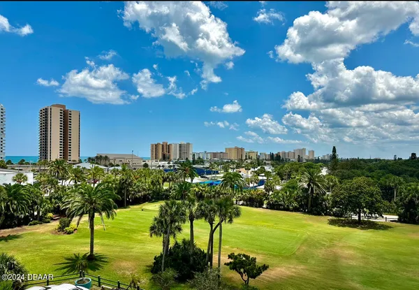 a view of a lake with a building in the background