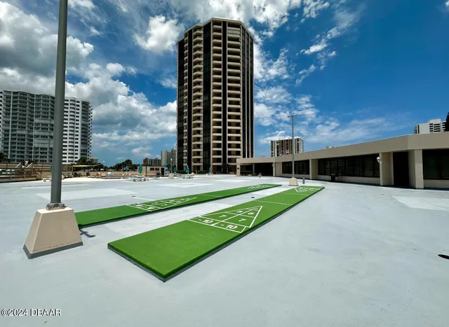 a view of a large building with a yard