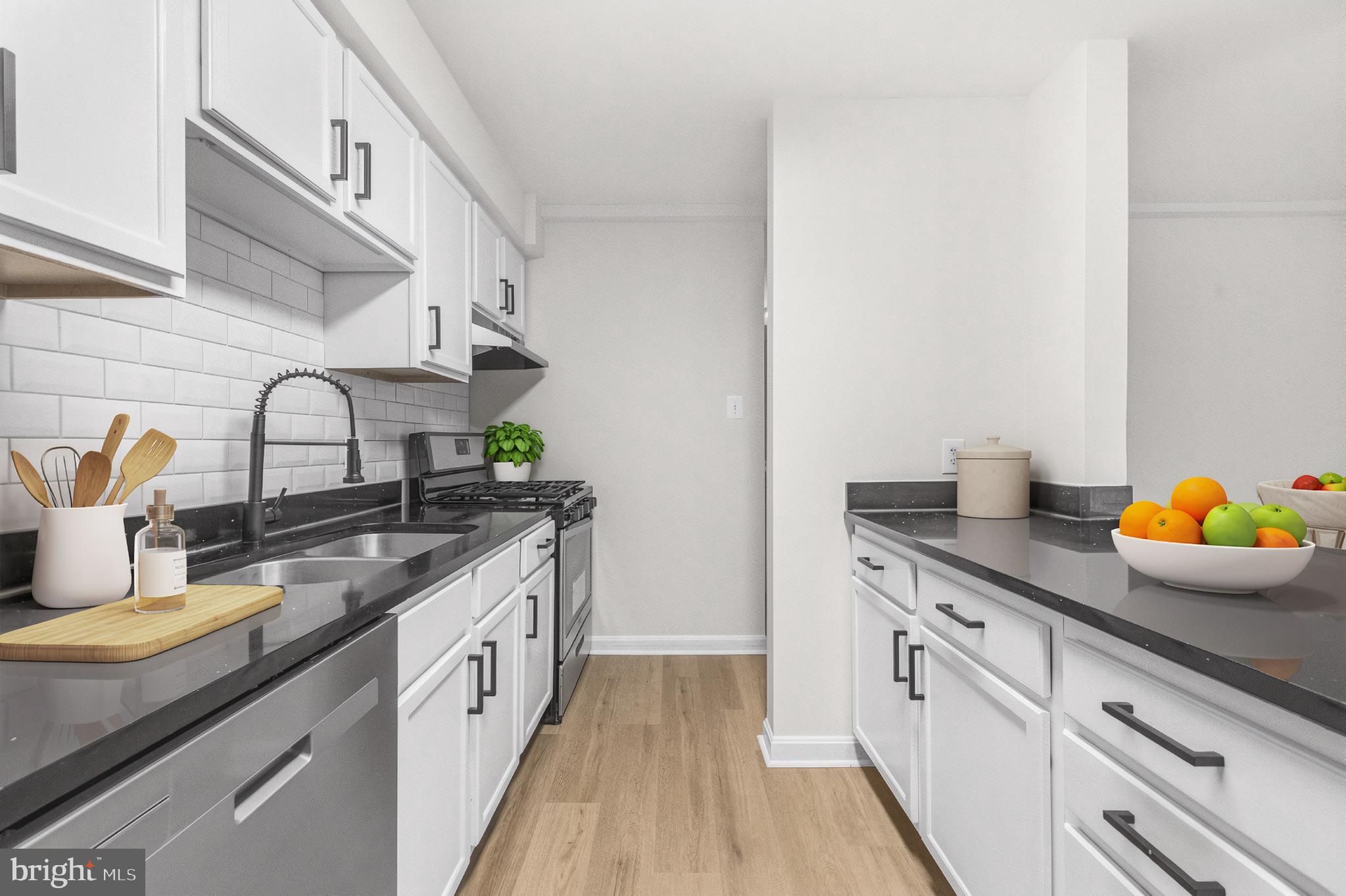 635 Waterloo Road, Unit 222 Warrenton, VA 20186 - Photo 13 of 28 a kitchen with granite countertop a sink and cabinets