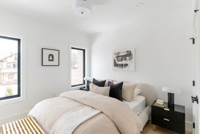 a bedroom with bed and a window