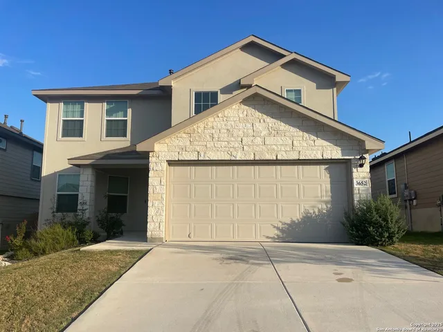 a view of house with garage