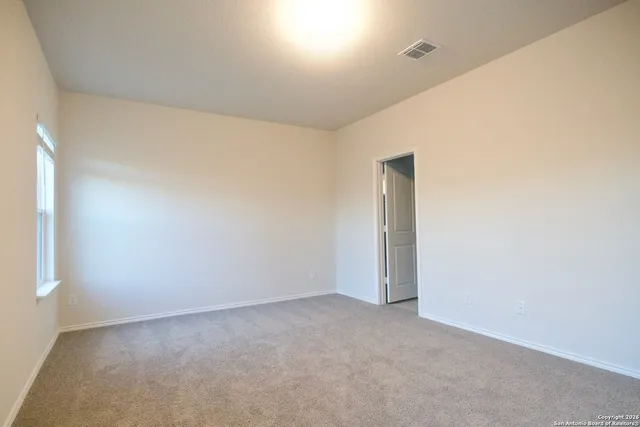 a view of staircase with white walls