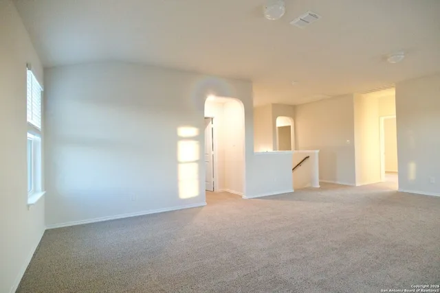 a bathroom with a granite countertop sink a toilet and shower