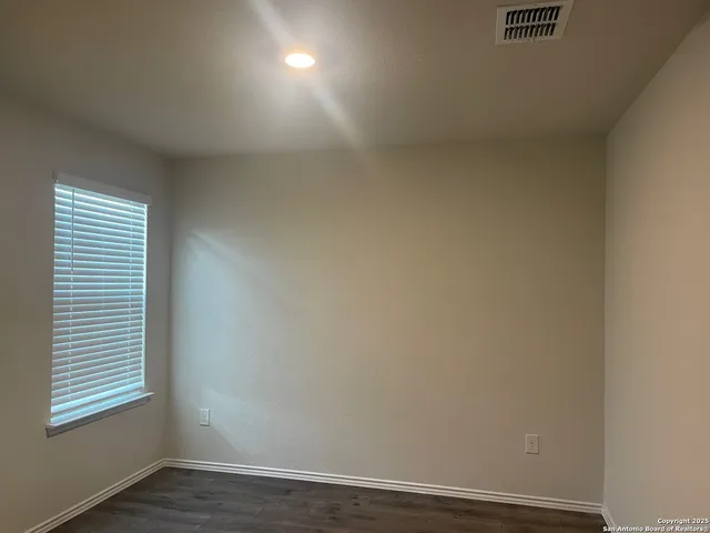 a kitchen with granite countertop a sink and a microwave
