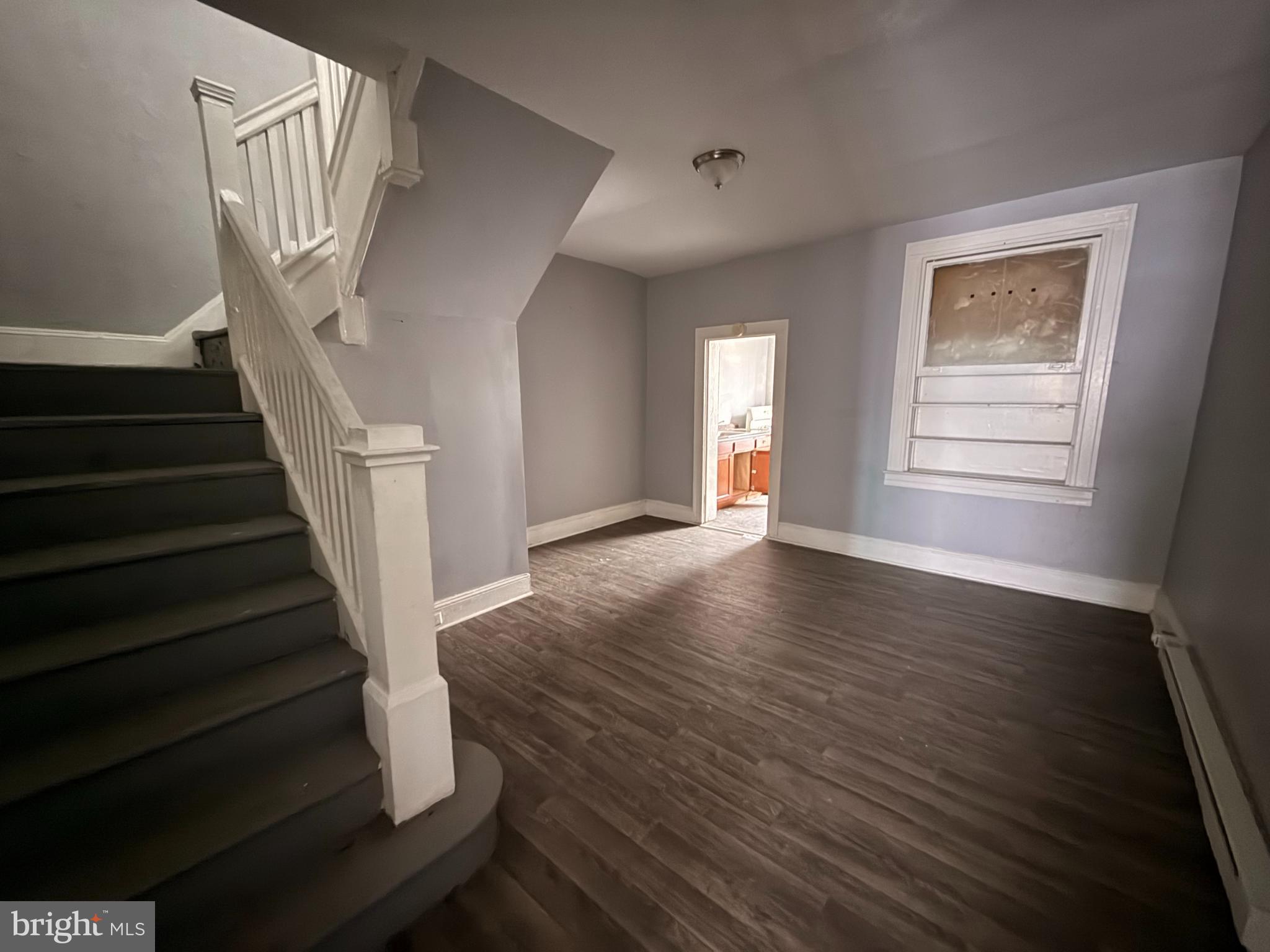 5313 Hamlin Avenue Baltimore, MD 21215 - Photo 4 of 14 a view of an entryway with wooden floor and door