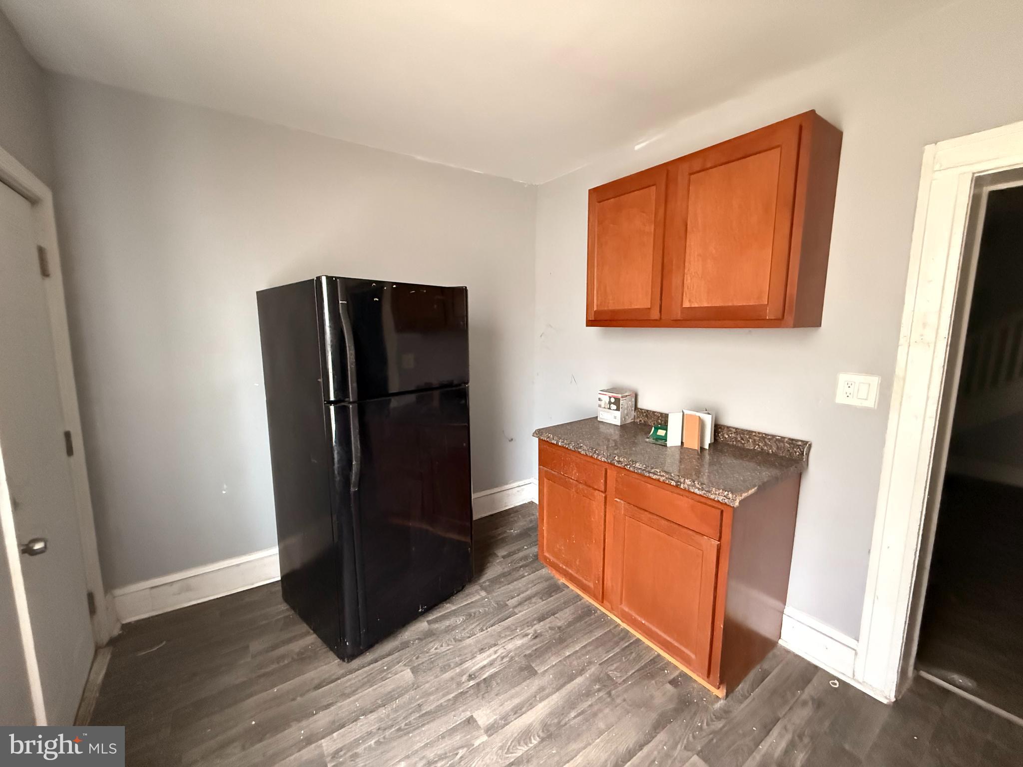 5313 Hamlin Avenue Baltimore, MD 21215 - Photo 7 of 14 a kitchen with stainless steel appliances granite countertop a refrigerator and a sink
