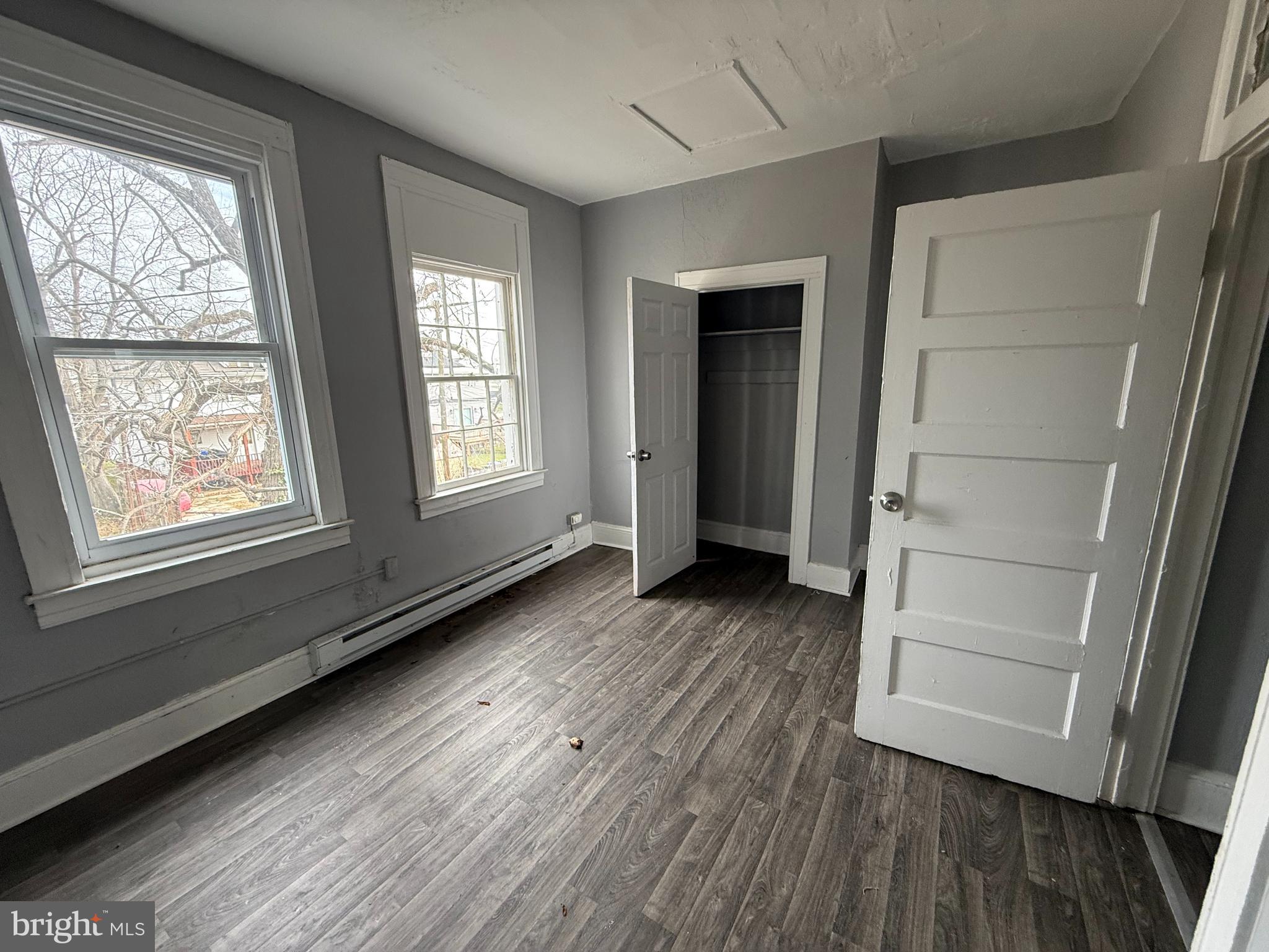 5313 Hamlin Avenue Baltimore, MD 21215 - Photo 9 of 14 wooden floor in an empty room with a window