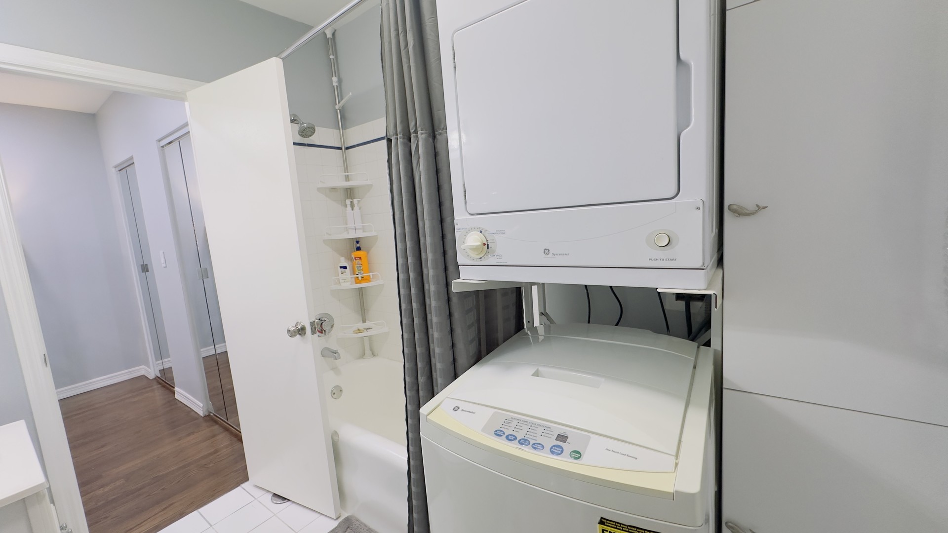 1411 West Farwell Avenue, Unit E2 Chicago, IL 60626 - Photo 25 of 27 a utility room with dryer and washer