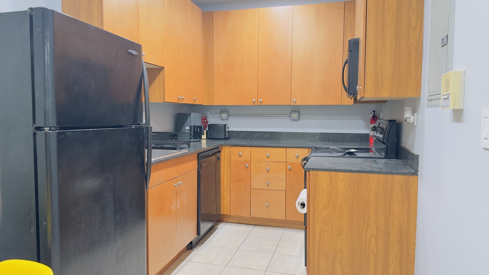 1411 West Farwell Avenue, Unit E2 Chicago, IL 60626 - Photo 7 of 27 a kitchen with a refrigerator and a stove