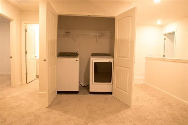 a view of an empty room with wooden walls