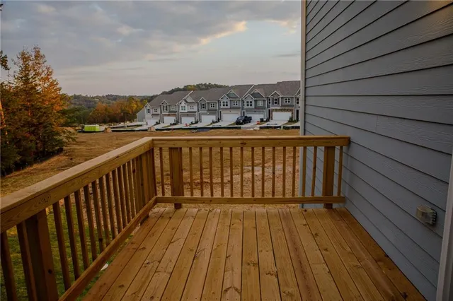 a view of balcony with wooden floor