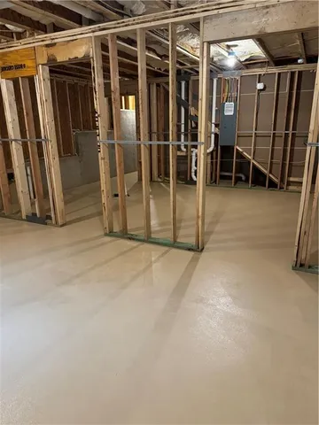 a view of an empty room with wooden walls