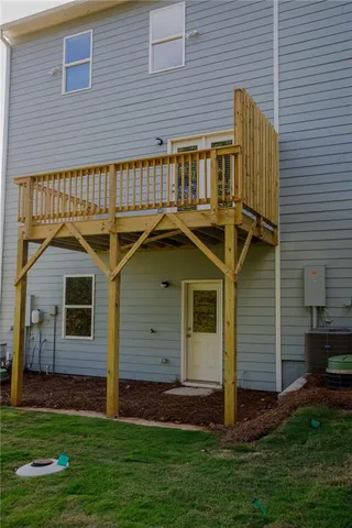 a view of a house with a small yard and a large window