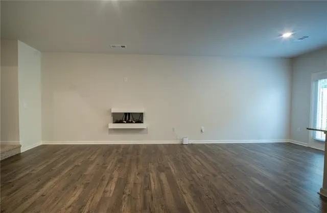 a view of an empty room and window