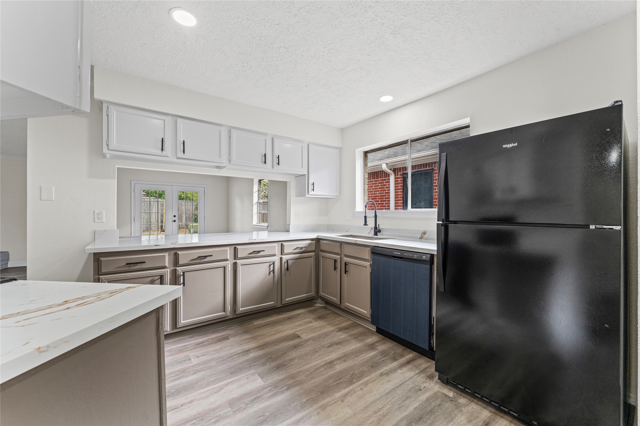 1506 Leadenhall Circle Channelview, TX 77530 - Photo 11 of 34 a kitchen with a refrigerator and a sink