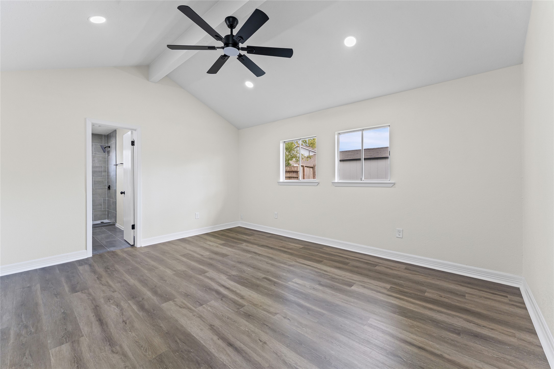 1506 Leadenhall Circle Channelview, TX 77530 - Photo 18 of 34 an empty room with wooden floor ceiling fan and windows