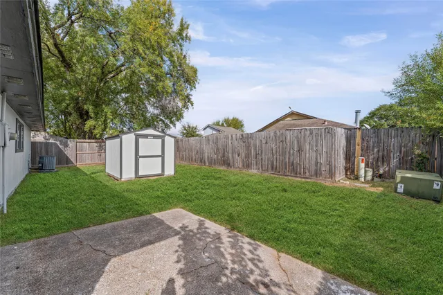 a backyard of a house with lots of green space