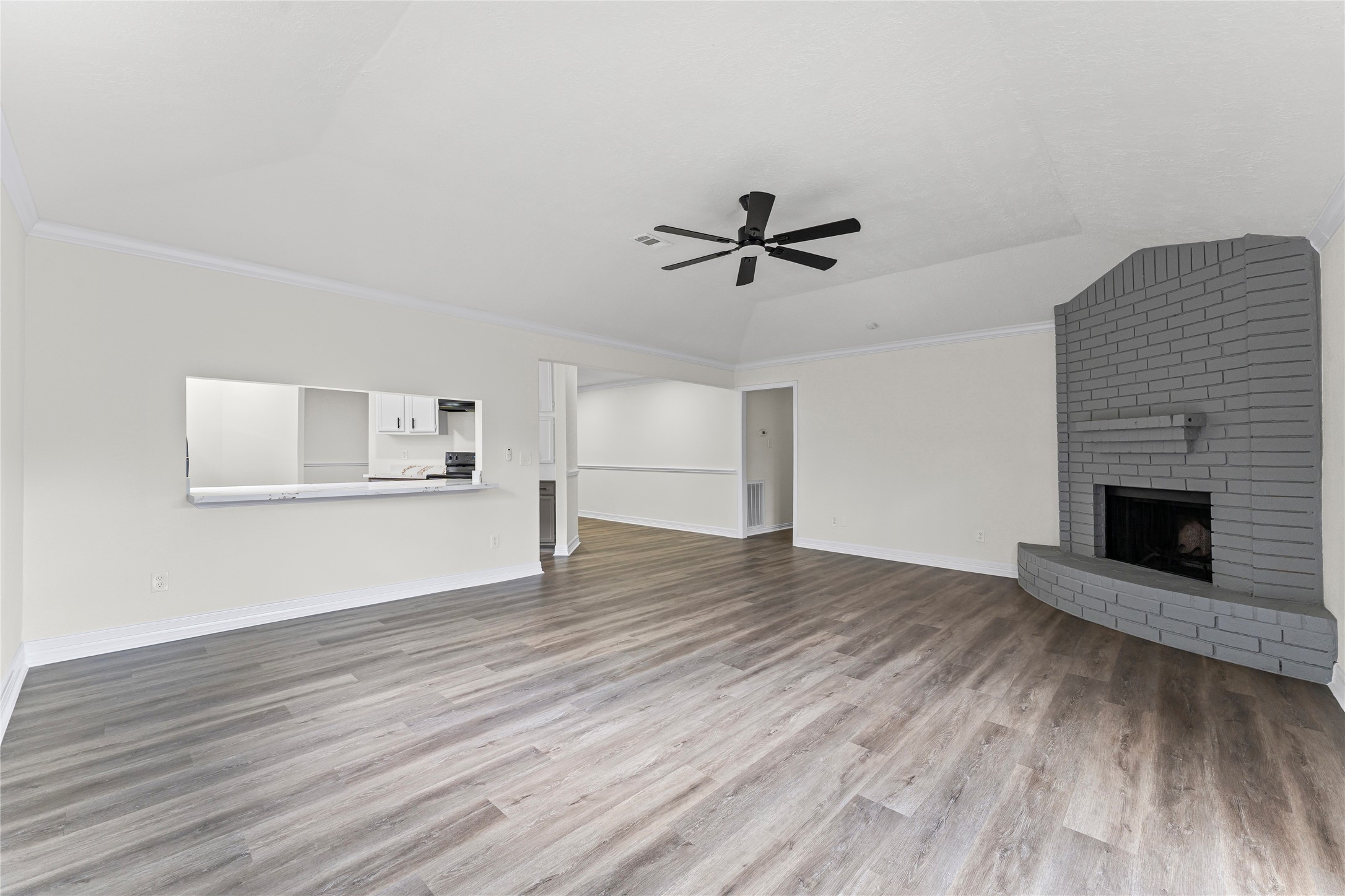 1506 Leadenhall Circle Channelview, TX 77530 - Photo 4 of 34 a view of empty room with wooden floor and fireplace