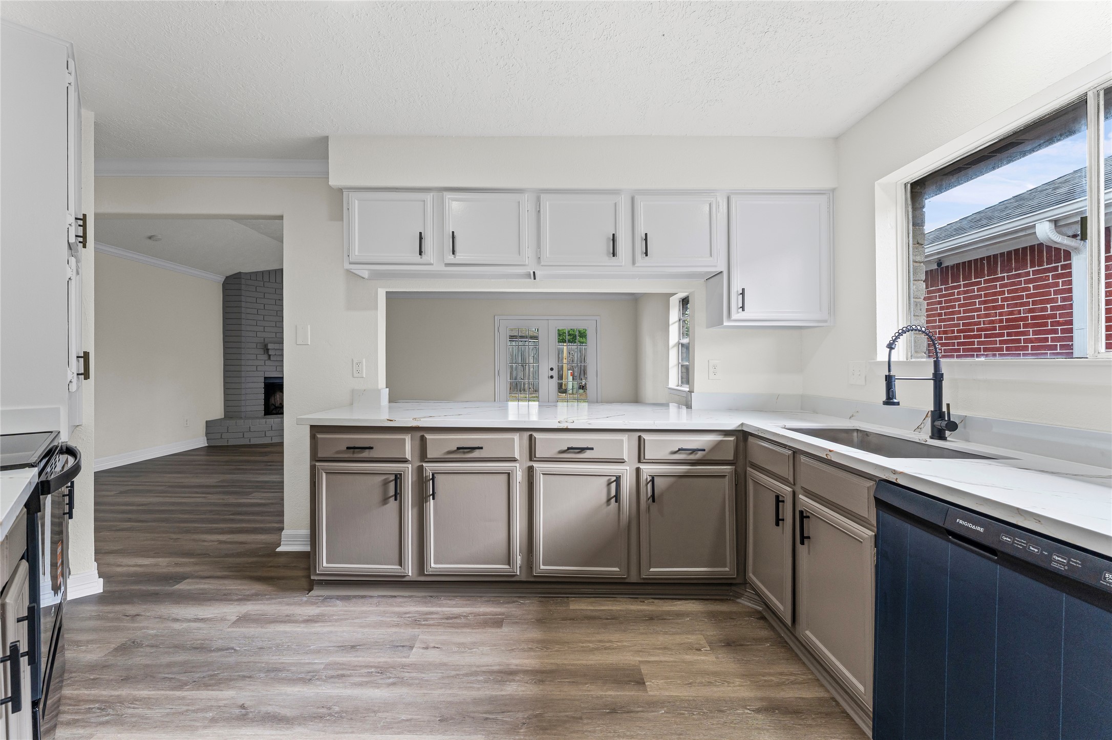 1506 Leadenhall Circle Channelview, TX 77530 - Photo 10 of 34 a kitchen with a sink cabinets appliances and a window
