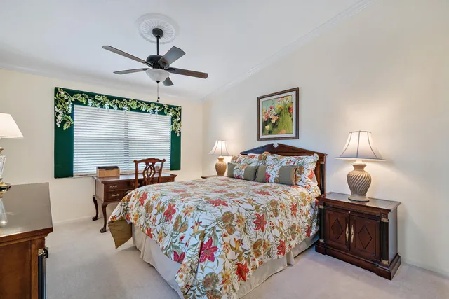 a bedroom with bed and window