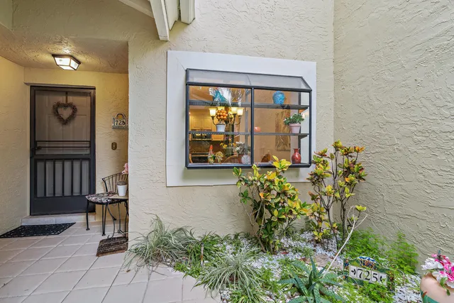 front view of a house with a bench