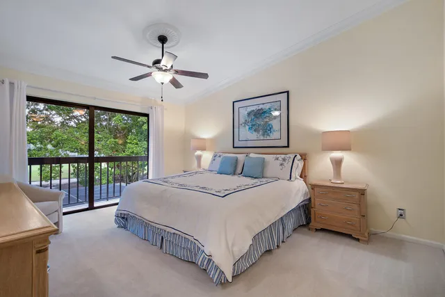 a spacious bedroom with a bed and a large window