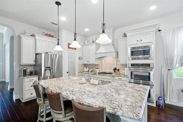 a kitchen with a table and chairs in it