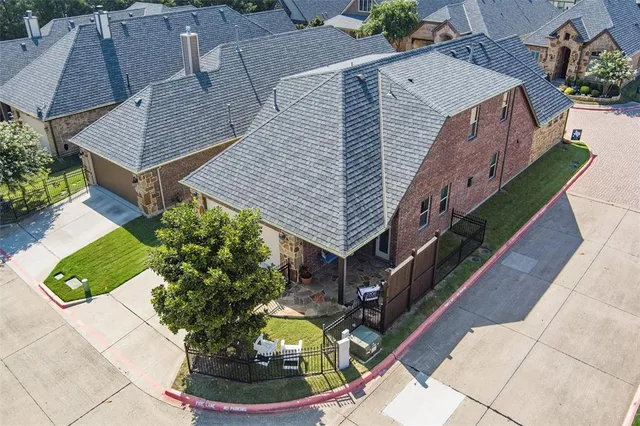 a aerial view of a house with swimming pool and sitting area