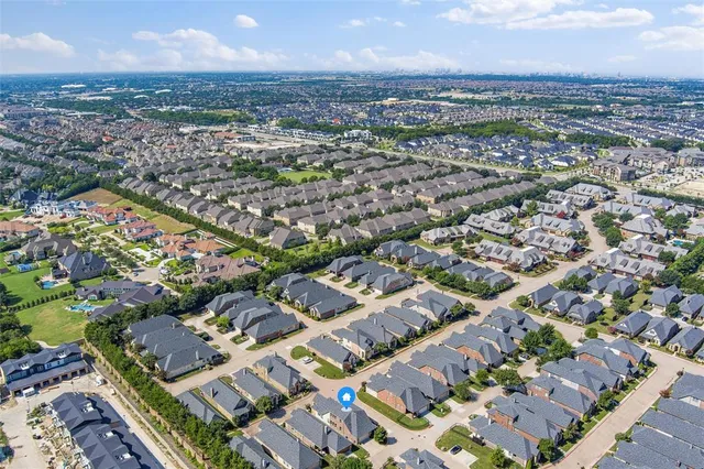 an aerial view of a city with lots of residential buildings