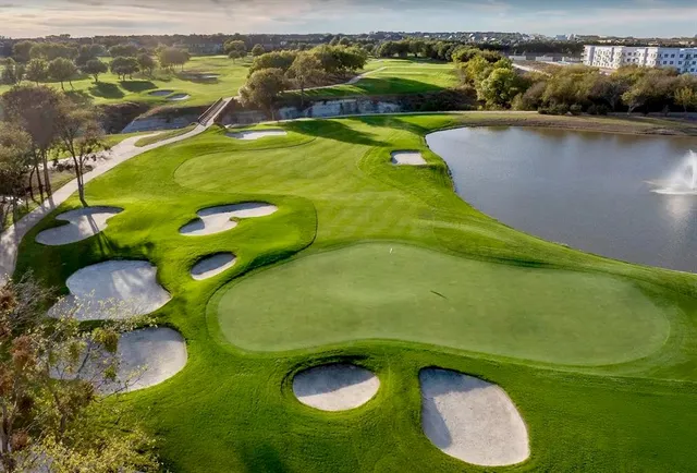 a view of a swimming pool with a yard